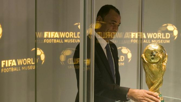 brazils-former-soccer-player-cafu-places-the-fifa-world-cup-trophy-into-a-glass-cabinet-during-a-media-preview-at-the-new-fifa-world-football-museum-in-zurich